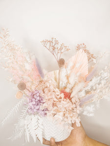 Pastel coloured innocent floral potted arrangement- blossom