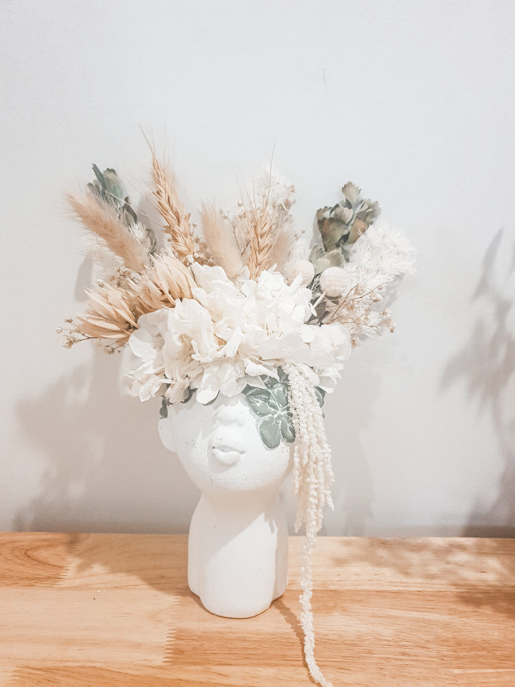 Pretty dried flowers in a face vase- Lady.