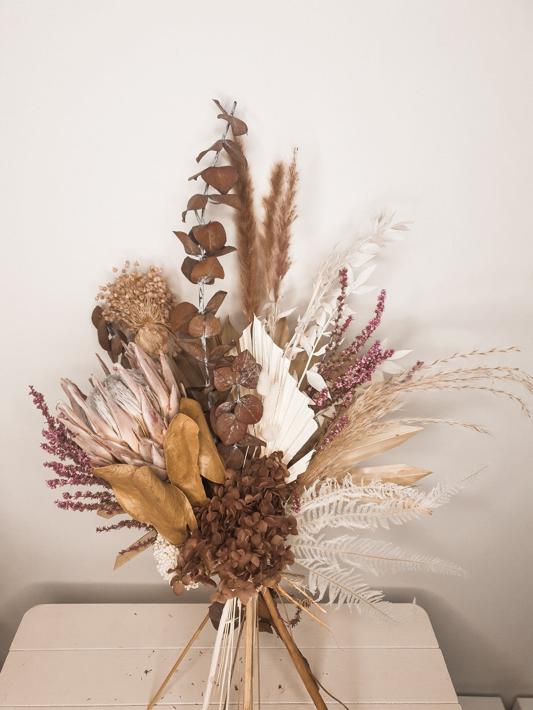 Chocolate dried floral bouquet, featuring deep warm tones.